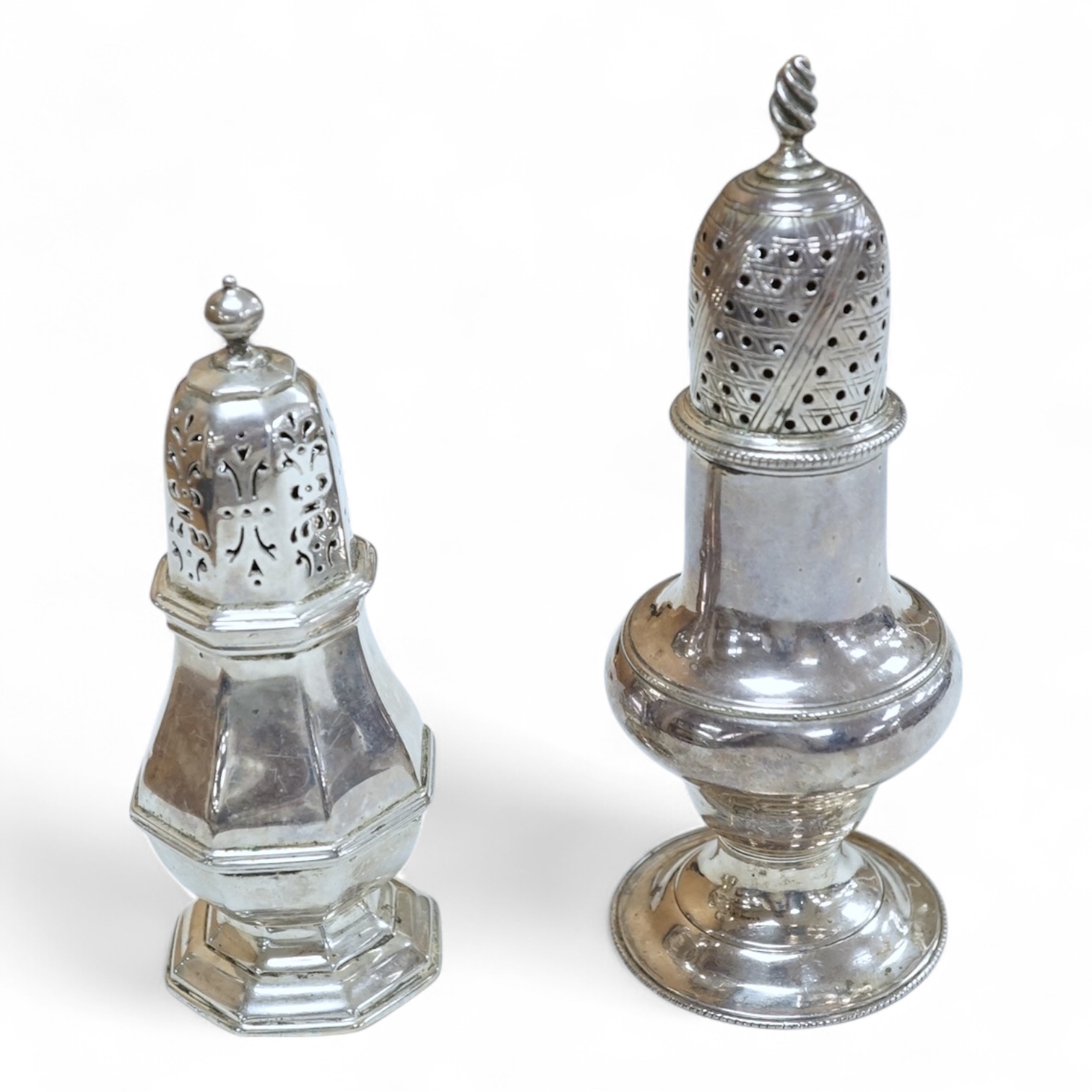 A George II silver pepperette, possibly by Joseph Sanders, London, 1739, 13cm, together with a George V silver pepperette.